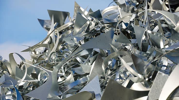 silver metal scrap against blue sky