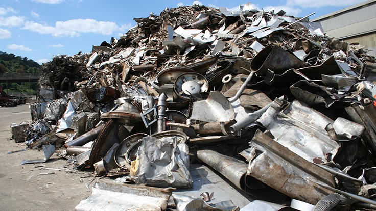 pile of stainless steel for recycling against blue sky