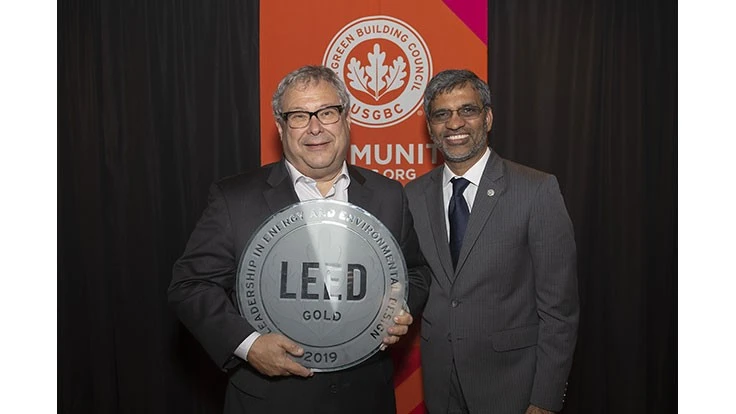 U.S. Green Building Council President Mahesh Ramanujam presents Atlanta Hawks and State Farm Arena CEO Steve Koonin with a plaque to honor State Farm Arena’s Gold LEED Certification June 13 at State Farm Arena in Atlanta.