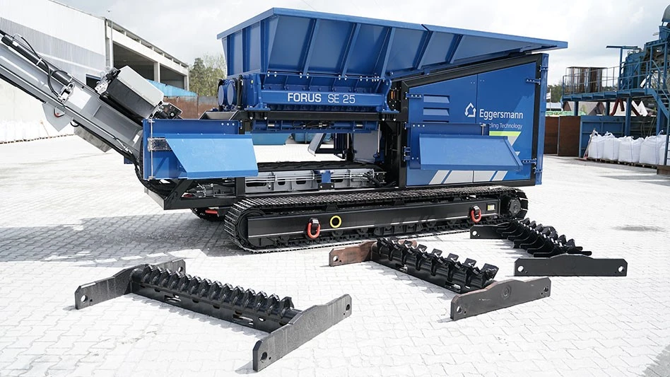 a blue piece of equipment with blades in front of it
