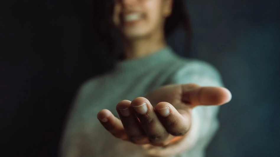 Woman reaching out to help