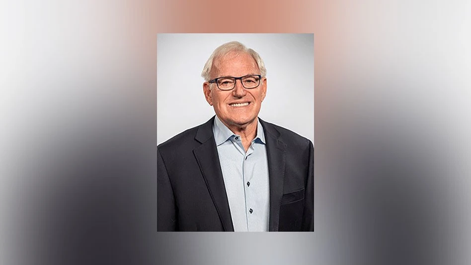 photo of a smiling man with glasses