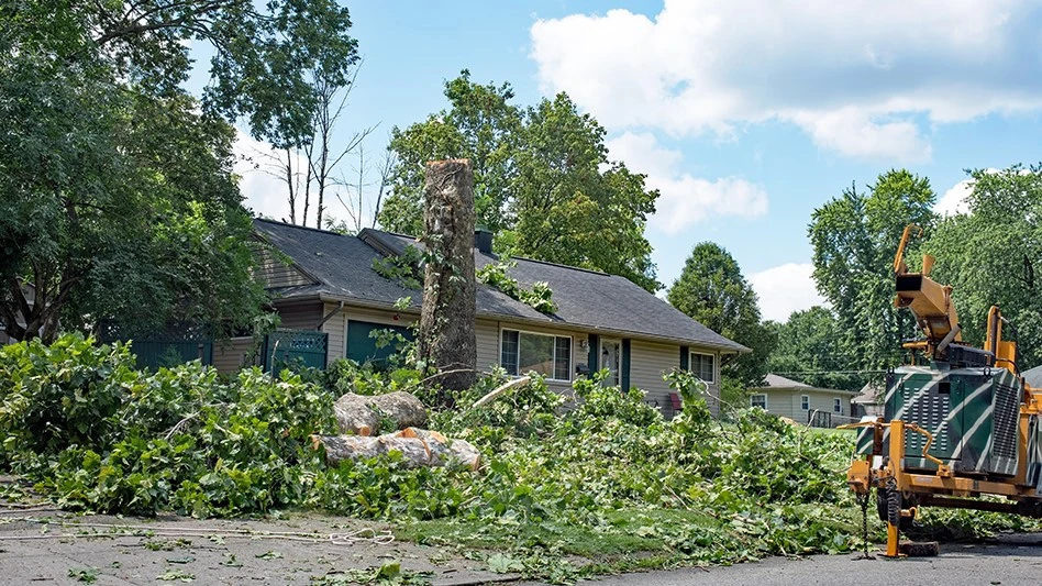 Wood debris in front of home after storm