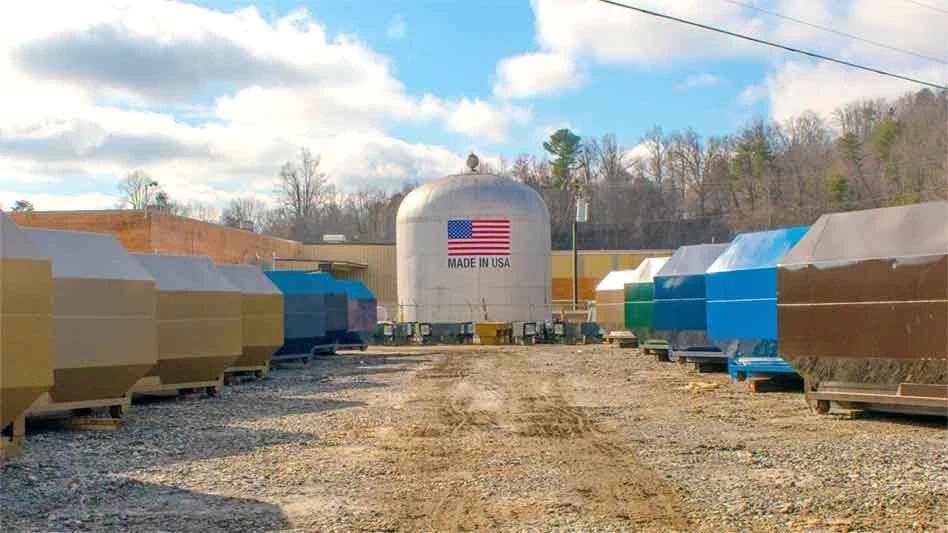 different color trash containers in a lot