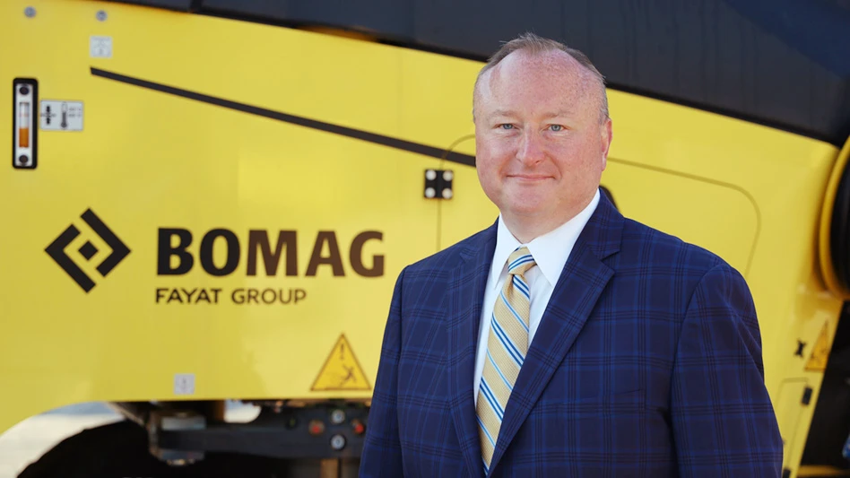 Brian Bieller in front of Bomag equipment