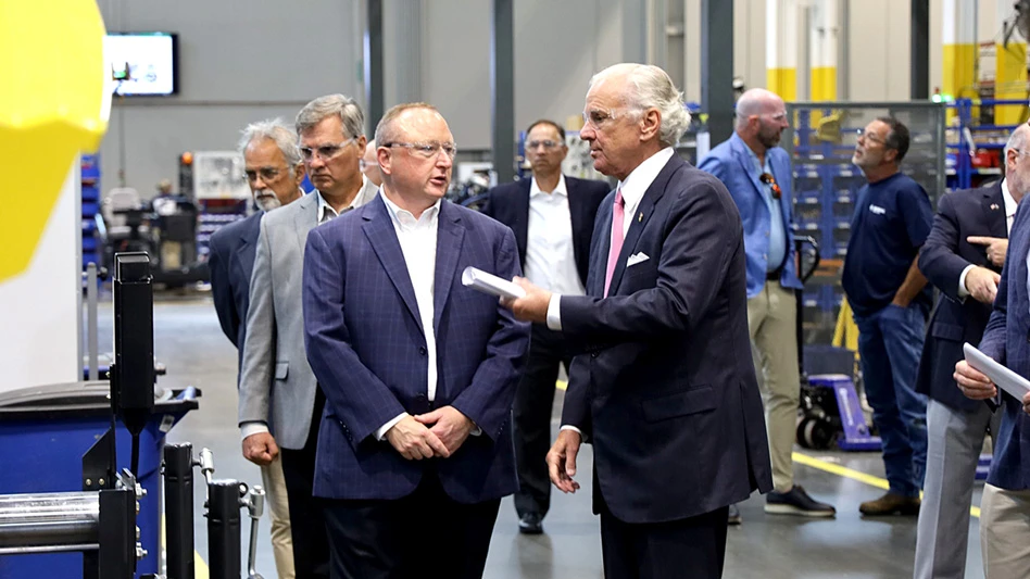 Bomag Americas President Brian Bieller and South Carolina Gov. Henry McMaster talk during a tour of Bomag's Ridgeway, South Carolina, facility.