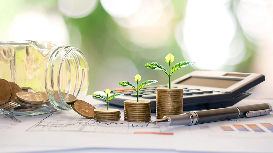 stacks of coins with plants growing out of them