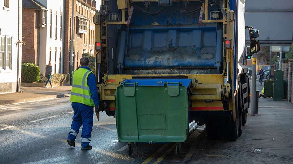 waste worker on collection route