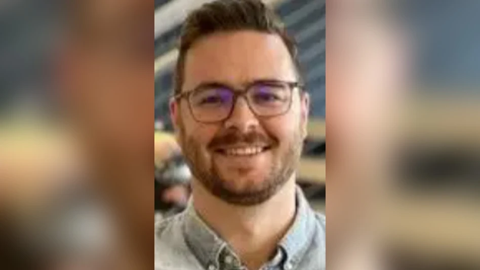 man with glasses smiling