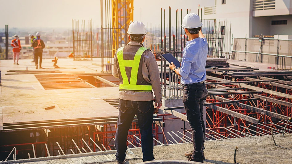 Construction workers sunset jobsite