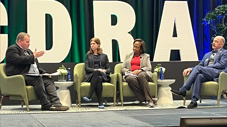 panel of 4 people speaking at conference